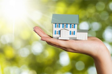 Building, mortgage, real estate and property concept - close up