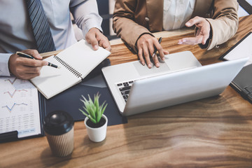 Business team colleague working with new startup project plan and discussion information for financial strategy with laptop, results of their successful teamwork