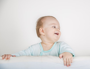 Fototapeta premium A one year boy in a crib
