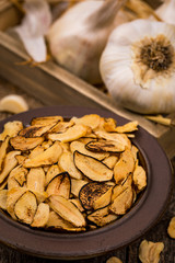 Fototapeta premium Roasted Garlic Slices. Selective focus.