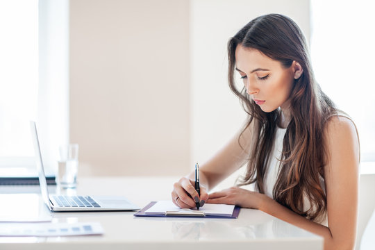 B usiness woman working in office with documents