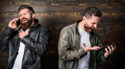 Mobile conversation and connect. Business call. Men brutal bearded hipster in fashionable leather...