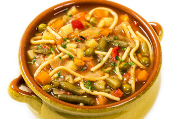 Vegetarian Vegetable Soup Isolated on a white background. Selective focus.