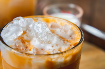 thai tea milkshank sweet drink on the glass for refreshment