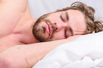 Fototapeta na wymiar Get adequate and consistent amount of sleep every night. How much sleep you actually need. Bearded man sleeping face relaxing on pillow. Expert tips on sleeping better. Man handsome guy lay in bed