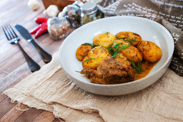 Piece of roasted pork and potatoes