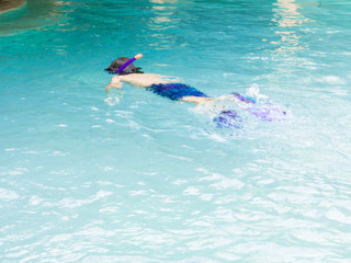 Teenager boy young snorkeler in a beautiful sea