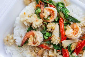 Fried basil shrimp with squid topped with rice