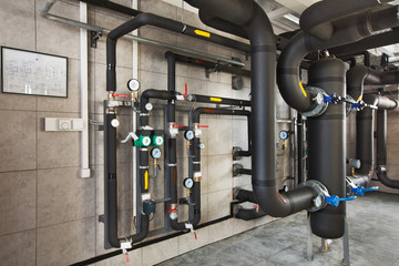 interior of industrial, gas boiler room with boilers; pumps; sensors and a variety of pipelines