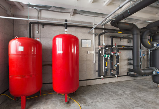 interior of industrial, gas boiler room with boilers; pumps; sensors and a variety of pipelines