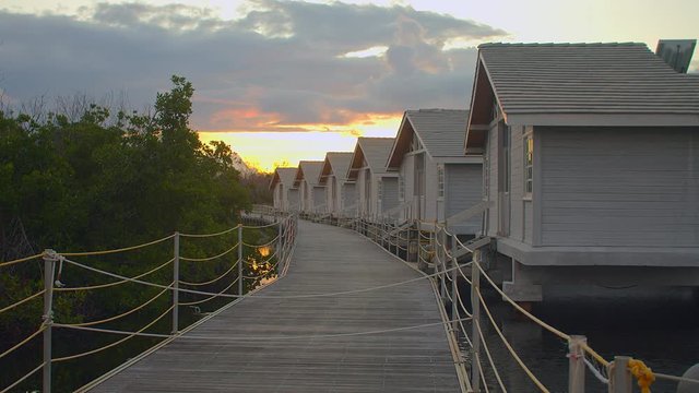 Floating house with wooden path at sunrise in Cayo Coco Cuba