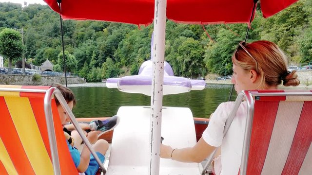 Mother with son on tourboat
