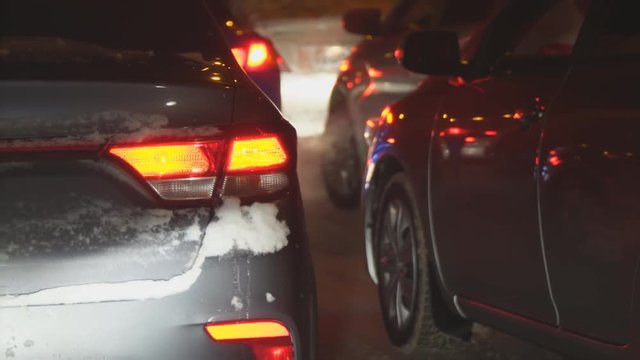 Cars in traffic in winter at night