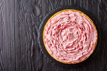 raspberry cheesecake on a black stone tray