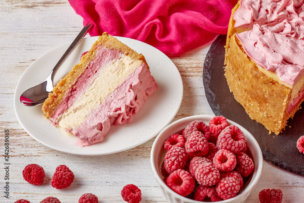 Sticker white chocolate and raspberry cheesecake, close up