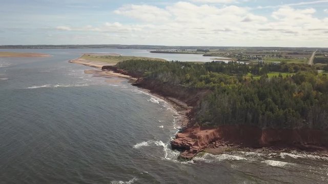 Aerial view of a beautiful rocky shore on the Atlantic Ocean. Taken in Cabot Beach Provincial Park, Prince Edward Island, Canada.