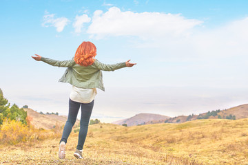 Beauty woman outdoors enjoying nature.