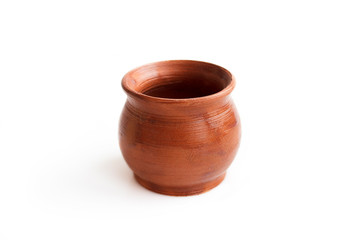 Clay pot, made by hand on a potter's wheel from red clay. Double burning. Transparent glaze applied by hand - visible potter's fingerprints and brush strokes. Handmade, single copy. isolated
