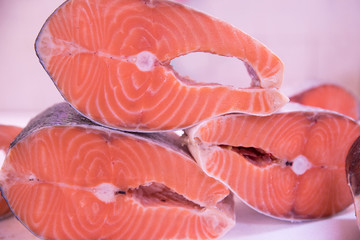 Fresh tasty salmon steaks close up ready for sale