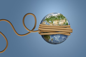 3d rendering of planet Earth, tied with a rope and thrown like a ball or a yo-yo. © gearstd