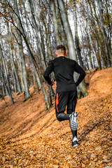 Athlete running in forest