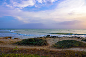 sunset in punta braccetto beach, ragusa, sicily, italy