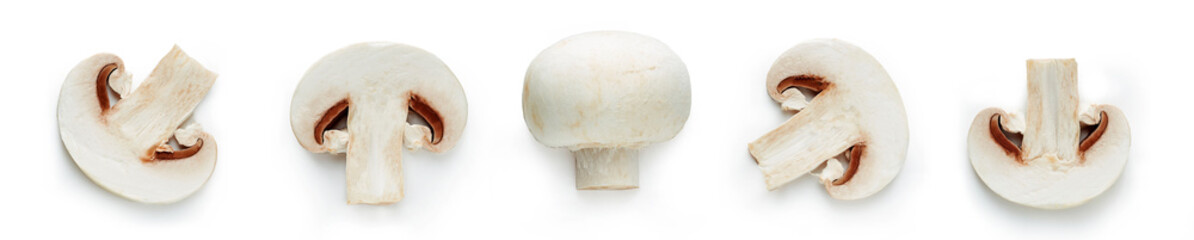 Set of fresh whole and sliced champignon mushrooms isolated on white background. Top view 