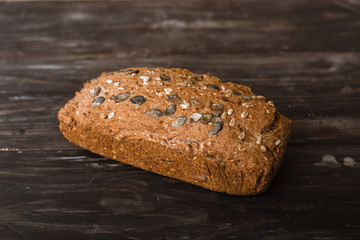 isolated chrono bread on dark brown wooden background