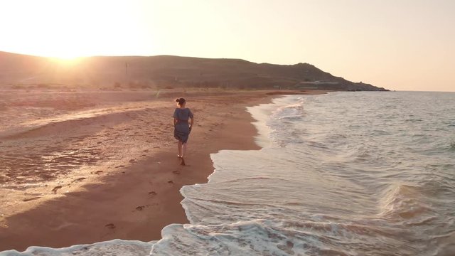 Woman runing at the beach
