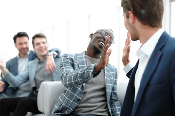 business colleagues make a welcome gesture with their fists