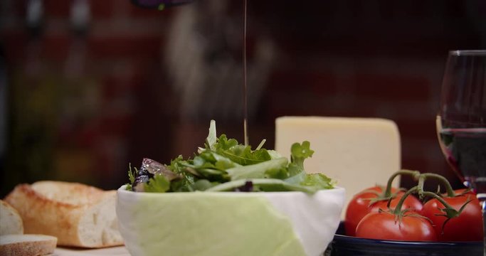 Pour A Vinaigrette Over Fresh Salad. Glamor Shots Of Fresh Food.