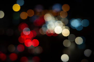 Bokeh night light on the avenue Light night at city blue bokeh sky festival abstract background blur lens flare reflection beautiful circle street with dark