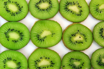 slice of kiwi on white background