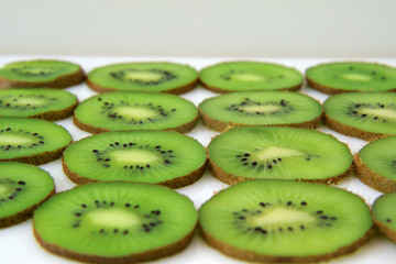 slice of kiwi on white background. ( point focusing )