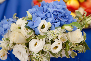 Blue hydrangea and white roses.