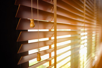 Wooden blinds with sun light.