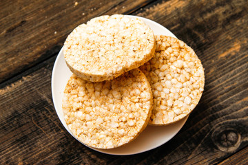Salty rice crackers galettes with spices. Tasty salty healthy biscuits.