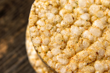 Salty rice crackers galettes with spices. Tasty salty healthy biscuits.