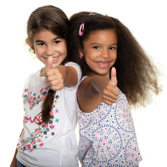 Hispanic and african-american small girls doing the thumb up sign