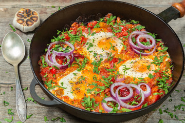 Traditional middle Eastern dish Shakshuka in a pan. 
