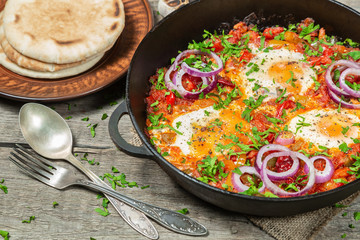 Traditional middle Eastern dish Shakshuka in a pan. 