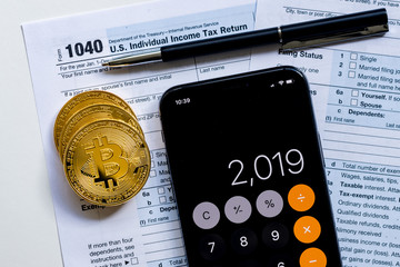 IRS 1040 tax form used to calculate capital gain or loss for bitcoin trading
