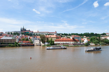 Fototapeta na wymiar View of old town and Prague castle. River Vltava, Czech Republic .