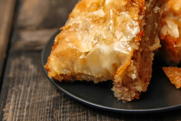 Baklava - homemade pie with walnuts on old wooden table