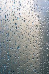 background of raindrops on window glass, close up