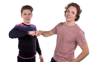 Portrait of a two cheerful young men celebrating isolated over white background