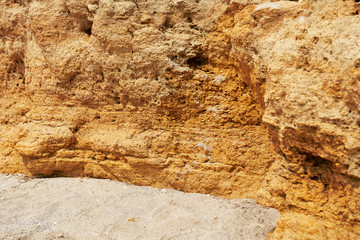 closeup of stone on the beach, sea coast with high hills, beautiful wild landscape