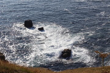 waves crashing on rocks