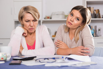mother and her adult daughter with financial problems