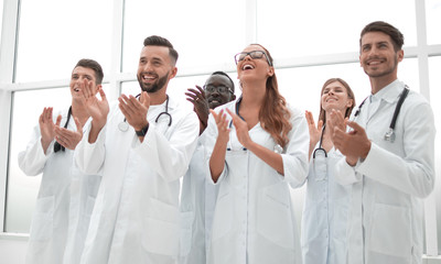 Fototapeta na wymiar fellow doctors are applauding and smiling